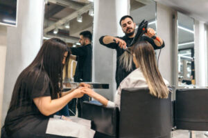Young woman  on manicure treatment at beauty salon